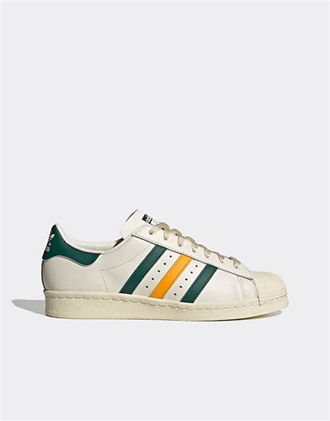 adidas sneaker grün mit gelben streifen|Grüne Sneaker .